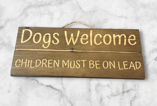 Funny Sign "Dogs Welcome, Children Must Be on Lead"