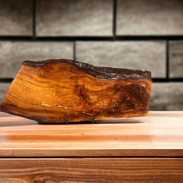 Unique Plum Wood Epoxy Charcuterie Board. Truly a piece of art.